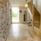 Salvaged stone wall in the entrance hall salvaged stone wall